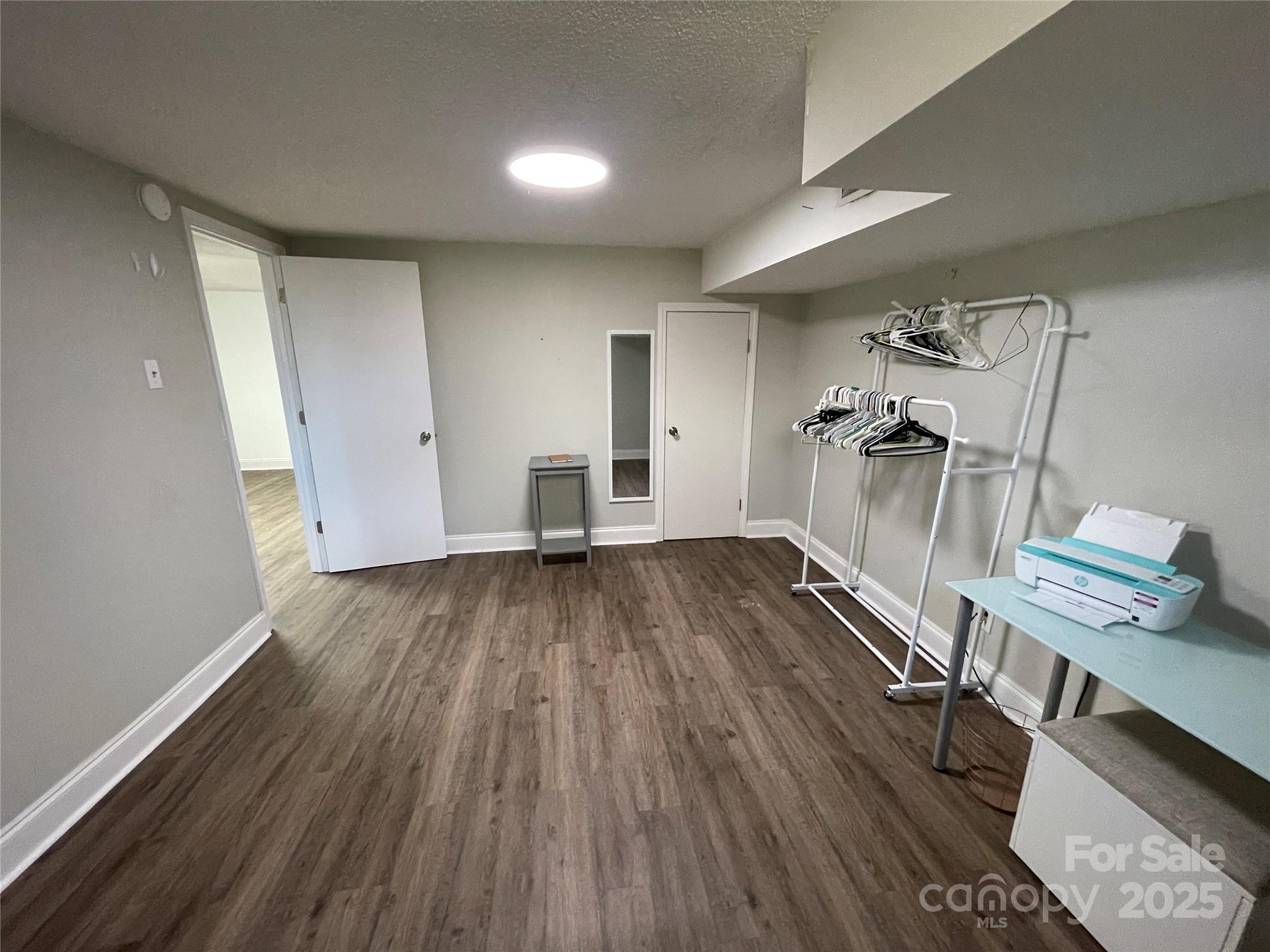 613 Gurley Street Albemarle, NC 28001 - Photo 26 of 43 a view of empty room with wooden floor