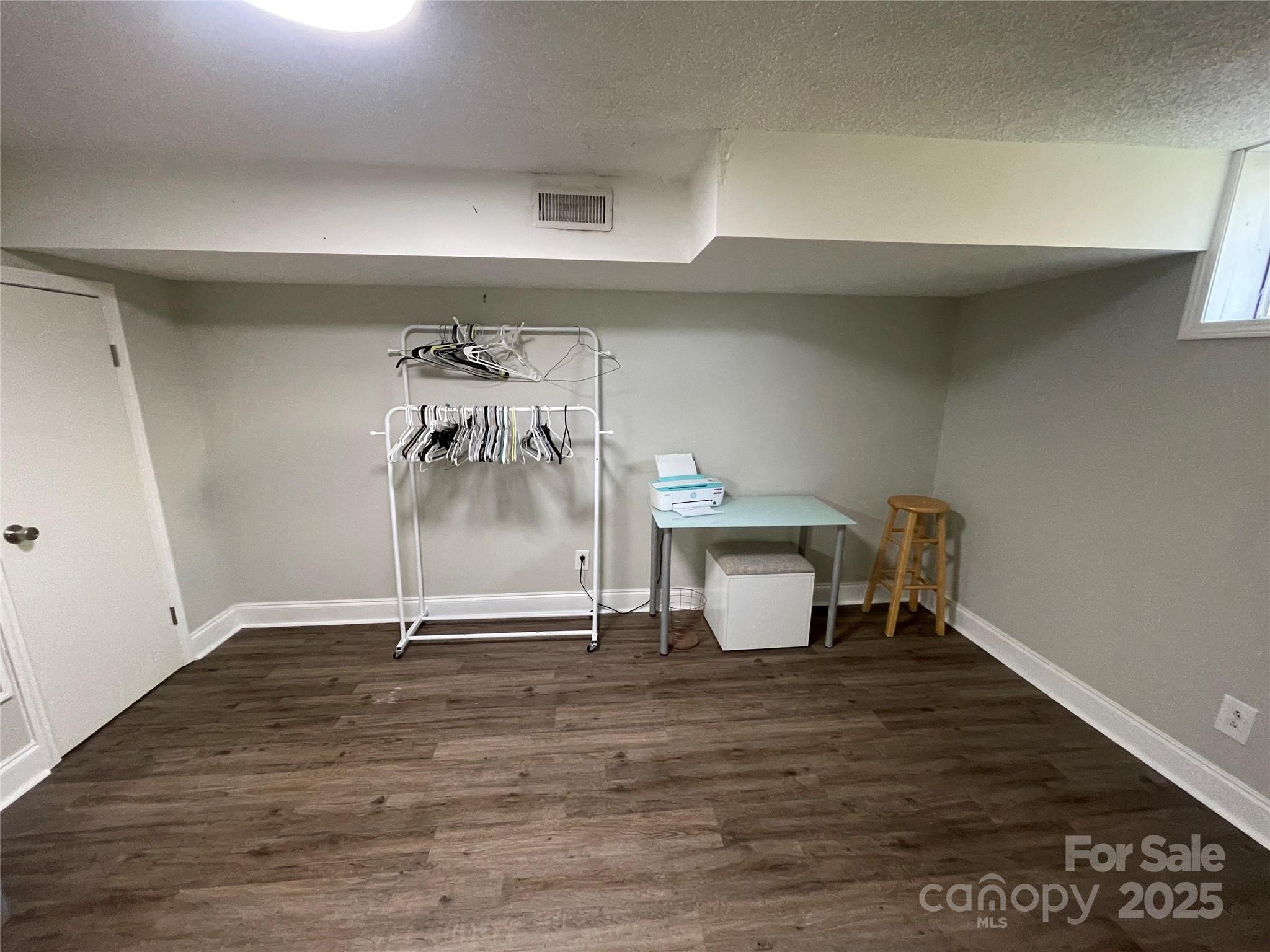 613 Gurley Street Albemarle, NC 28001 - Photo 28 of 43 a view of empty room with wooden floor