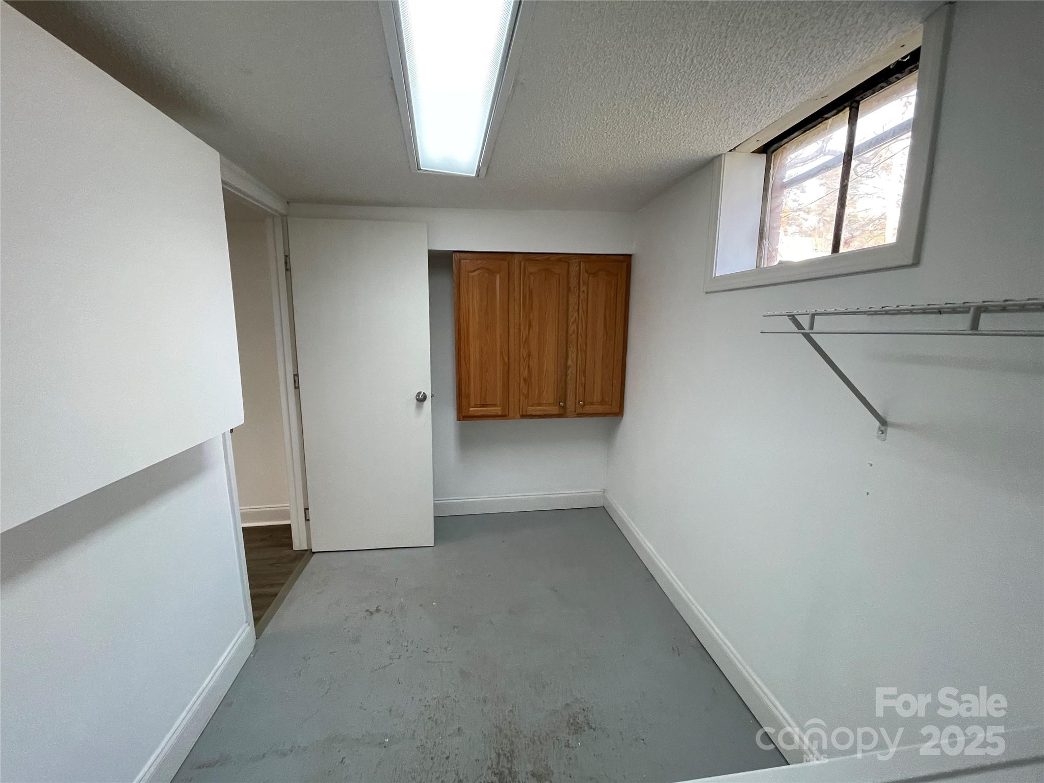 613 Gurley Street Albemarle, NC 28001 - Photo 30 of 43 an empty room with windows