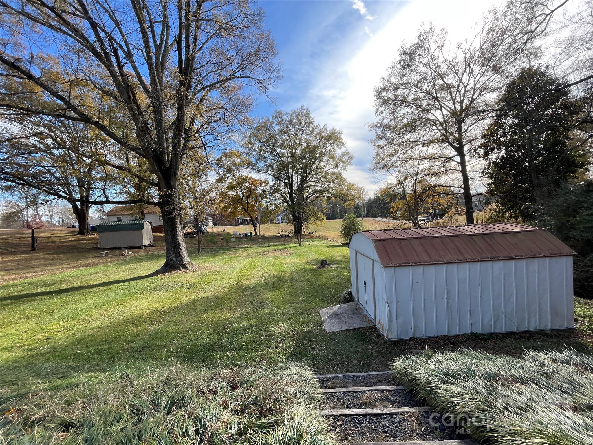 613 Gurley Street Albemarle, NC 28001 - Photo 38 of 43 a view of a backyard with trees