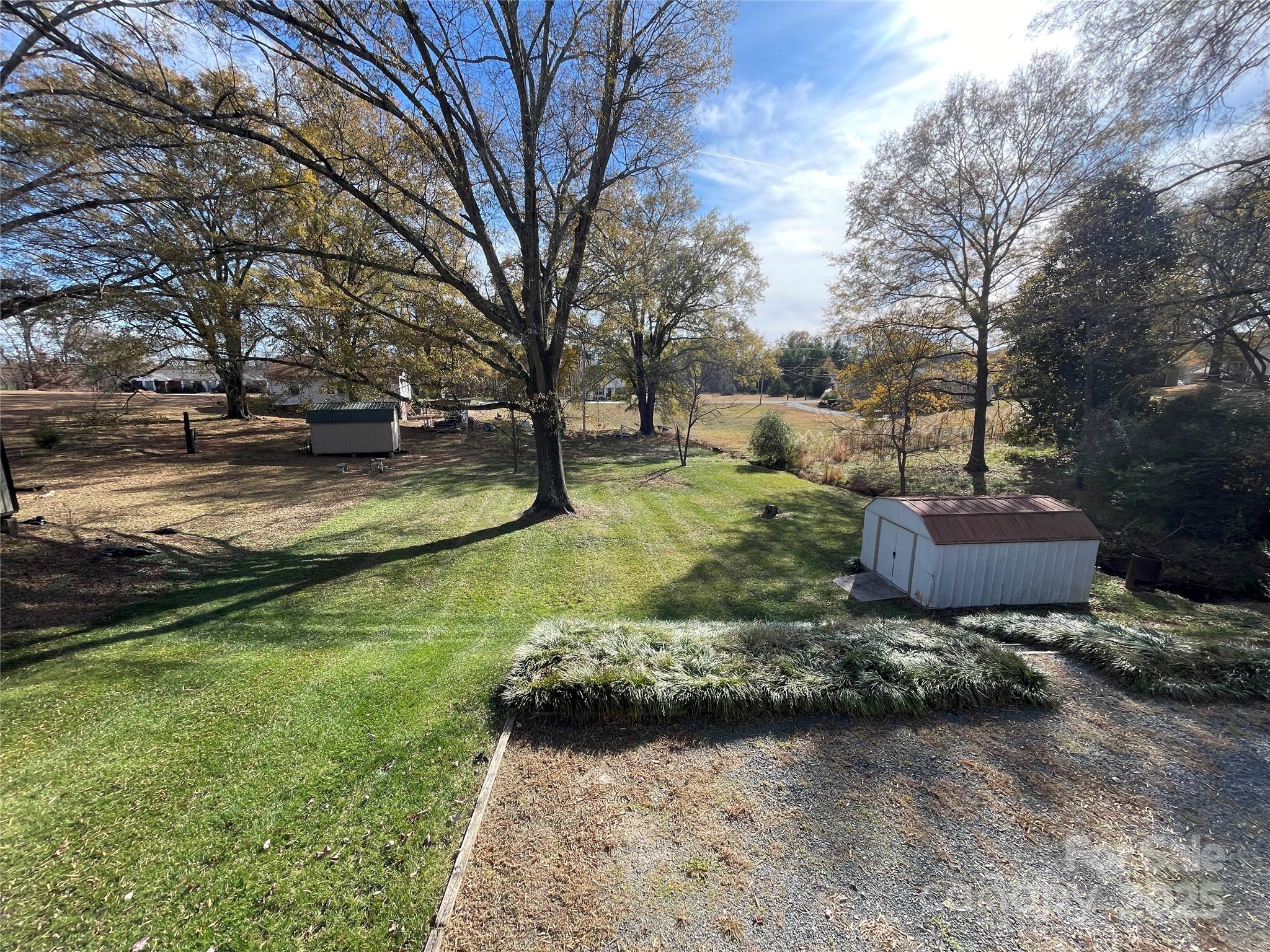 613 Gurley Street Albemarle, NC 28001 - Photo 43 of 43 a view of a backyard with large trees