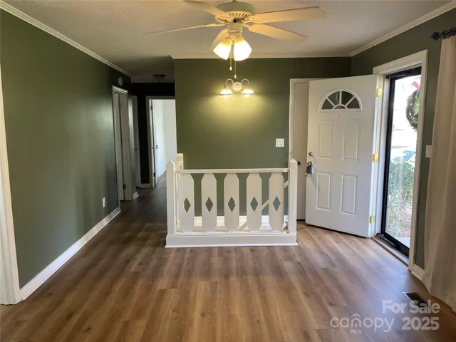 an entryway with wooden floor