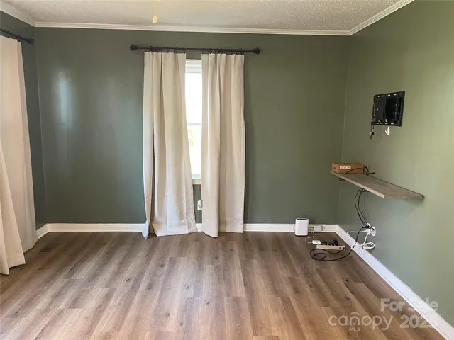 a view of a livingroom with wooden floor