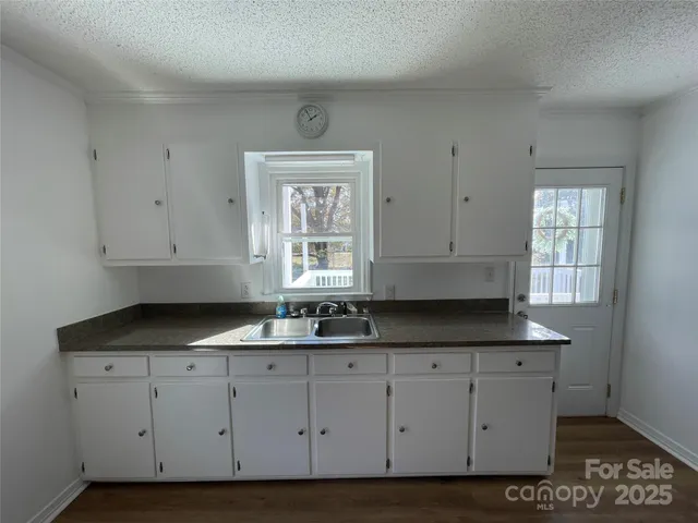 a view of cabinets with granite countertop cabinets