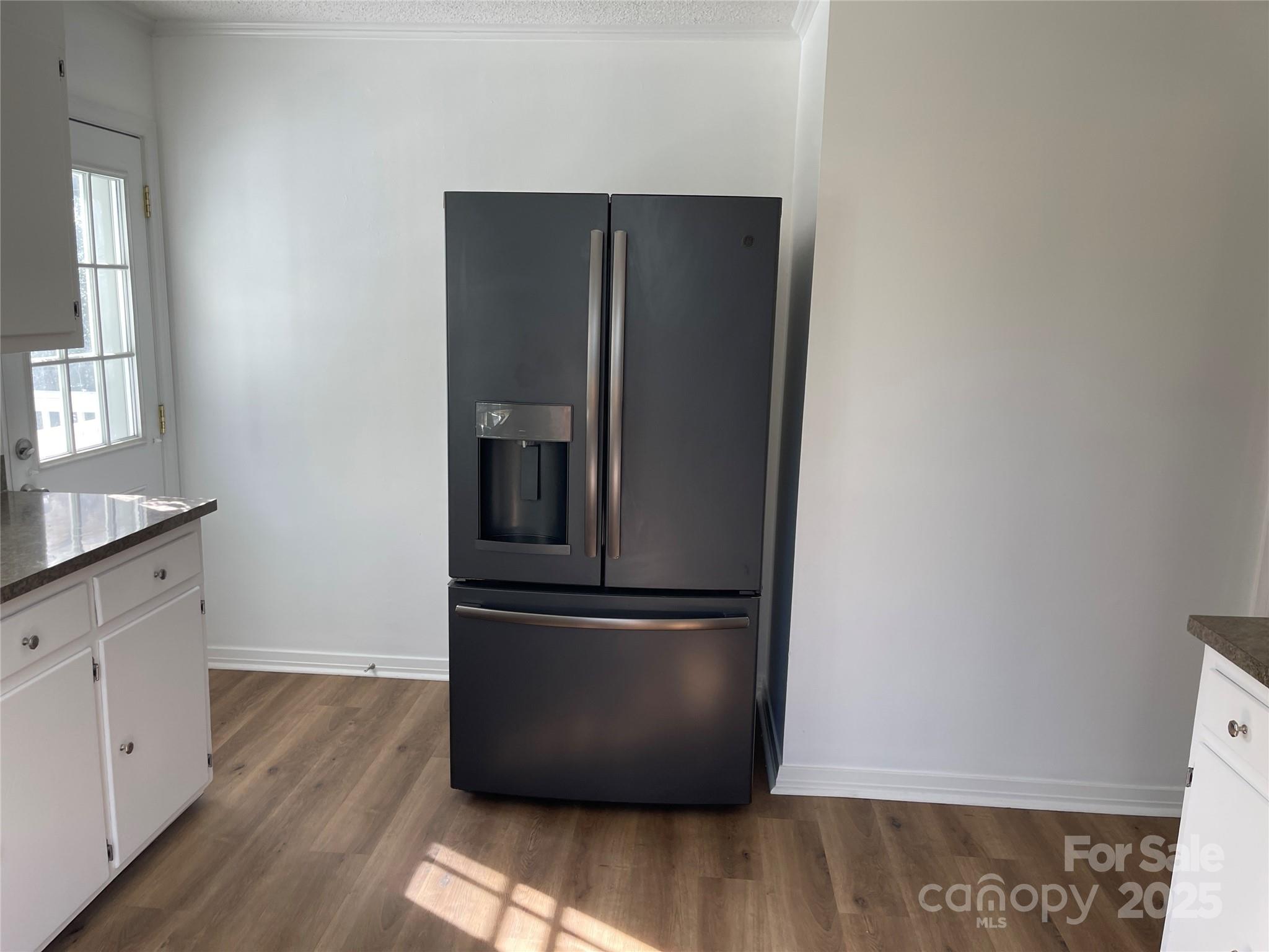 613 Gurley Street Albemarle, NC 28001 - Photo 10 of 43 a view of kitchen with wooden floor