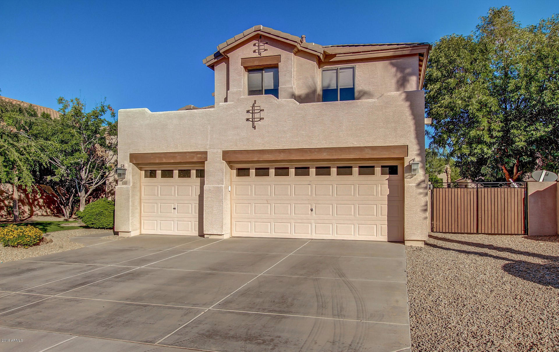 1360 East Harrison Street Gilbert, AZ 85295 - Photo 4 of 34 front view of a house with a garage