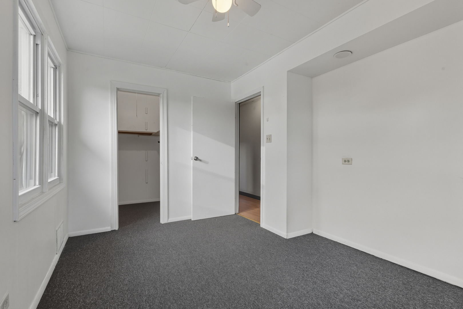 11013 Menard Avenue Chicago Ridge, IL 60415 - Photo 11 of 40 an empty room with windows