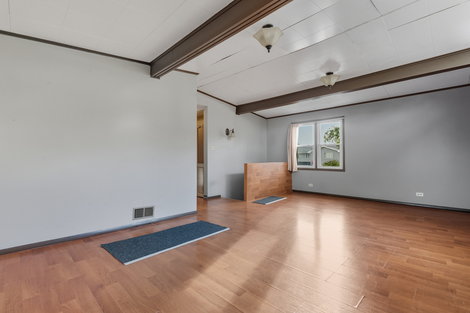 11013 Menard Avenue Chicago Ridge, IL 60415 - Photo 16 of 40 a view of a room with wooden floor and windows