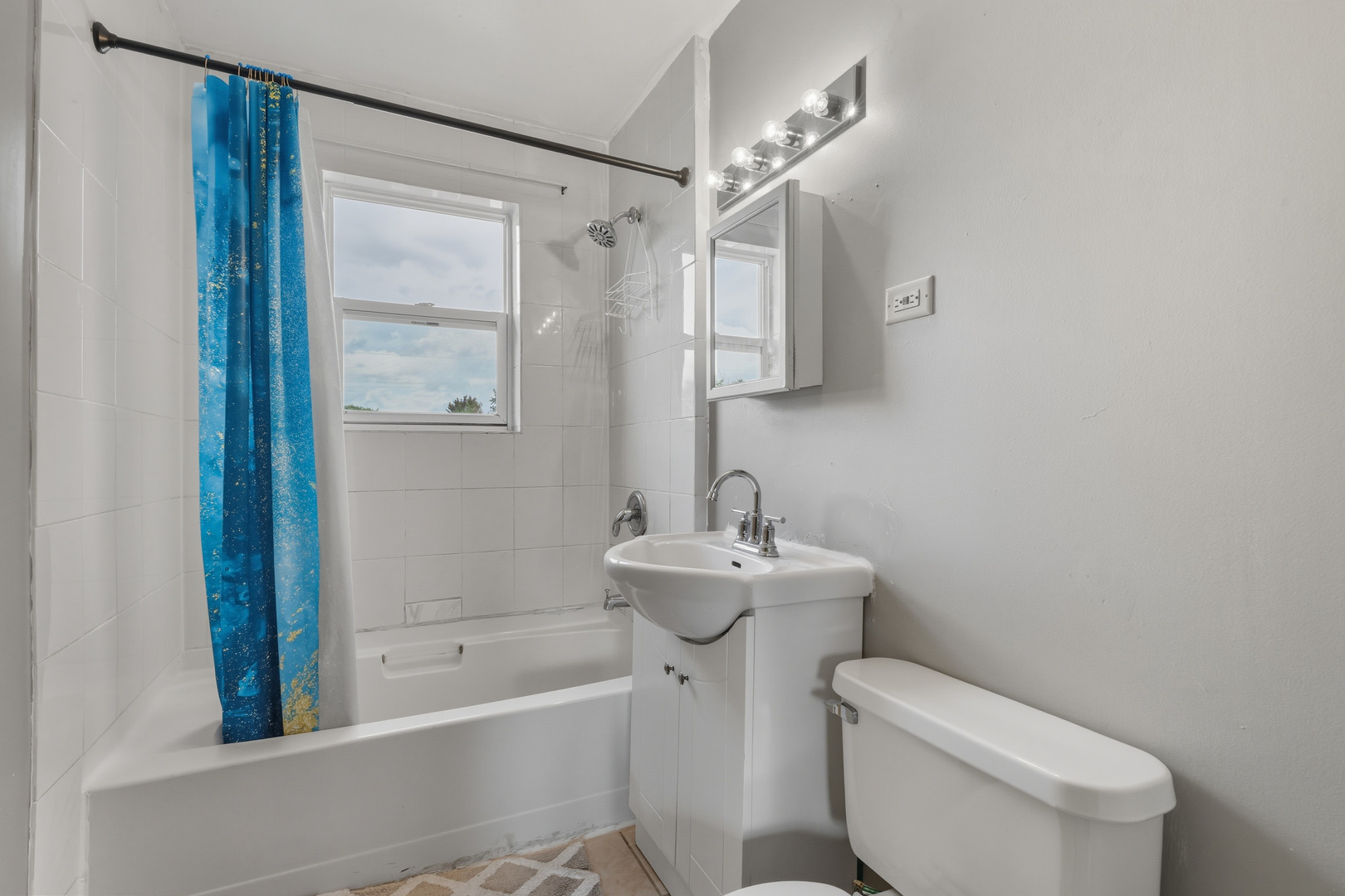 11013 Menard Avenue Chicago Ridge, IL 60415 - Photo 20 of 40 a bathroom with a sink a toilet and shower