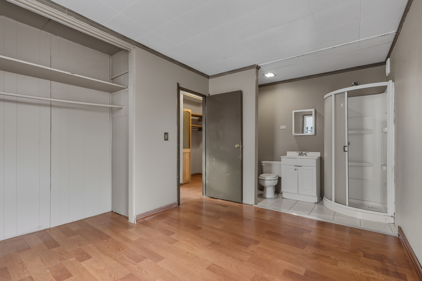 11013 Menard Avenue Chicago Ridge, IL 60415 - Photo 23 of 40 a view of a bathroom with a glass door and shower