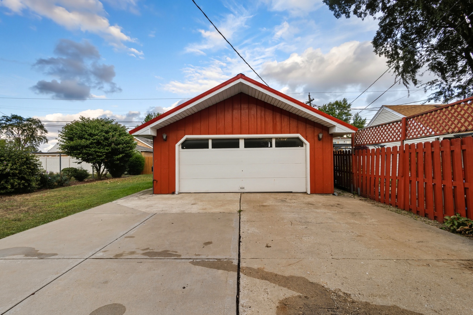 11013 Menard Avenue Chicago Ridge, IL 60415 - Photo 32 of 40 a front view of a house with a yard and garage