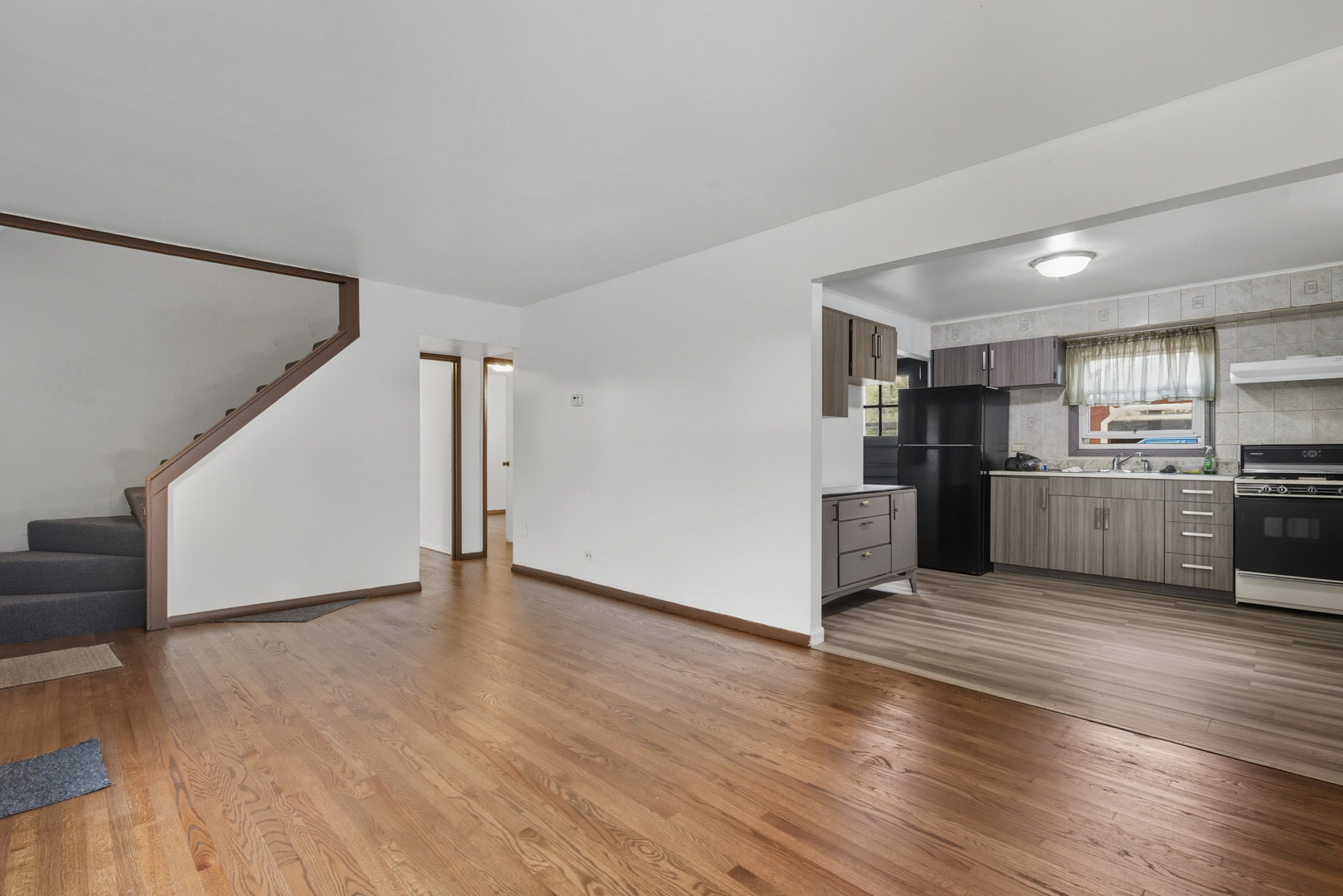 11013 Menard Avenue Chicago Ridge, IL 60415 - Photo 4 of 40 a view of kitchen with wooden floor and electronic appliances