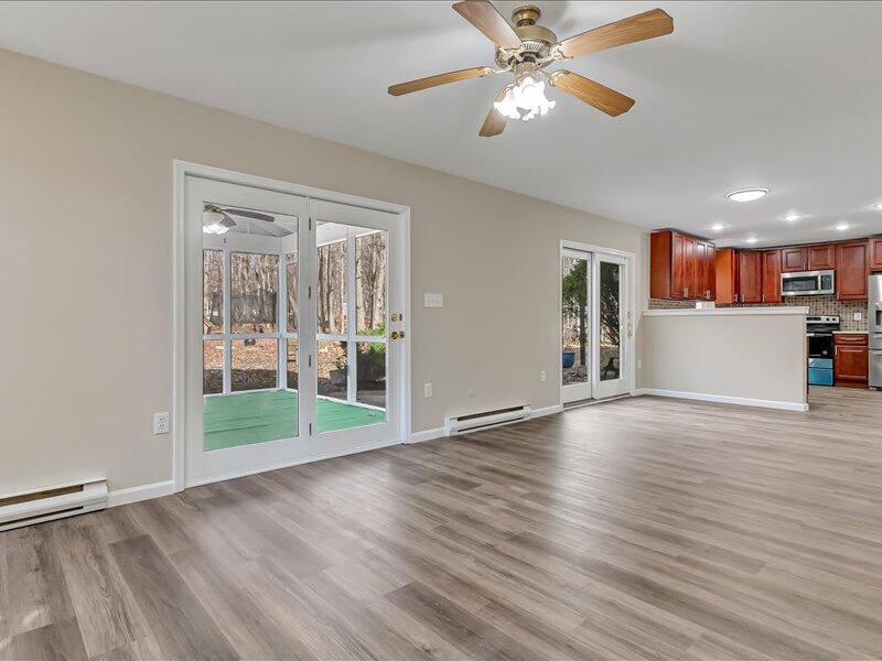 1135 Juno Drive Effort, PA 18330 - Photo 12 of 68 a view of a room with wooden floor and a ceiling fan