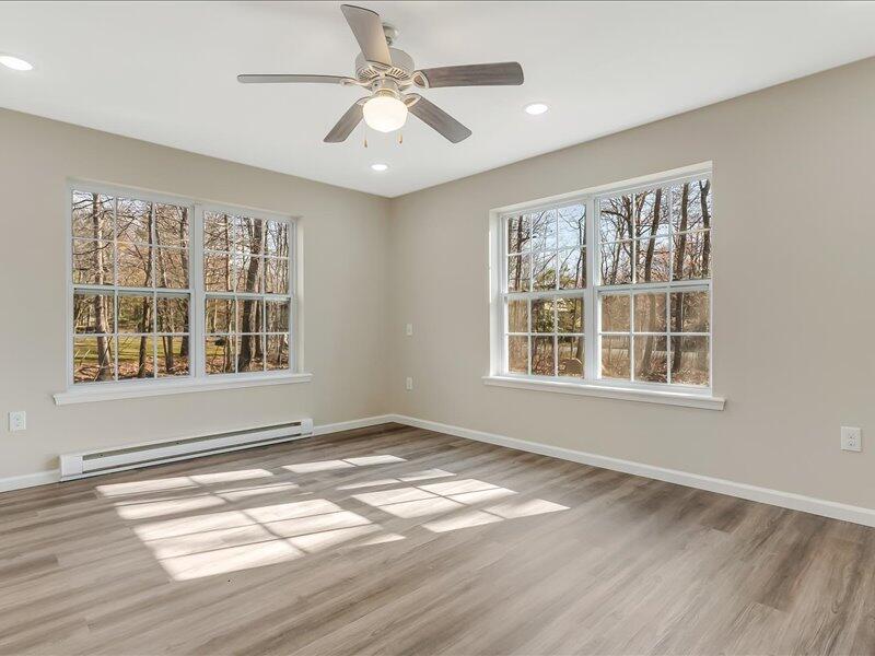 1135 Juno Drive Effort, PA 18330 - Photo 13 of 68 a view of an empty room with a window and wooden floor