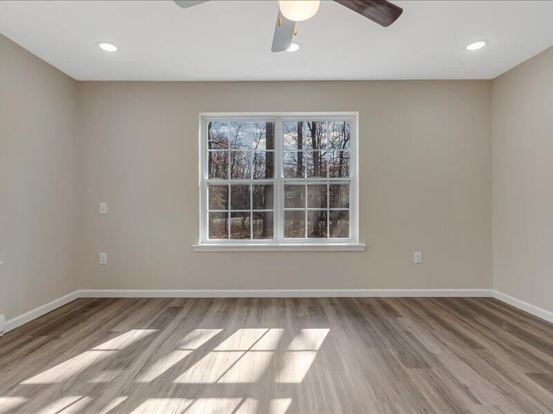 1135 Juno Drive Effort, PA 18330 - Photo 14 of 68 an empty room with wooden floor and windows