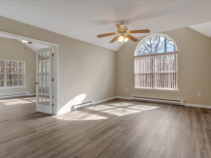 1135 Juno Drive Effort, PA 18330 - Photo 23 of 68 an empty room with wooden floor fan and windows