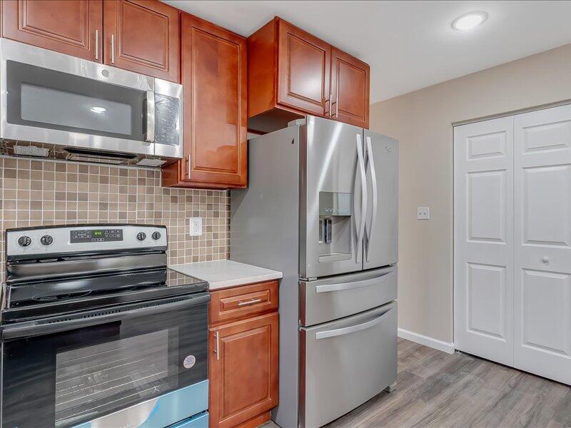 1135 Juno Drive Effort, PA 18330 - Photo 30 of 68 a kitchen with granite countertop stainless steel appliances and wooden cabinets