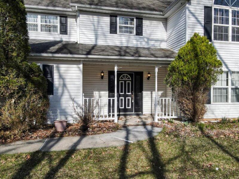 1135 Juno Drive Effort, PA 18330 - Photo 6 of 68 a front view of a house with garden