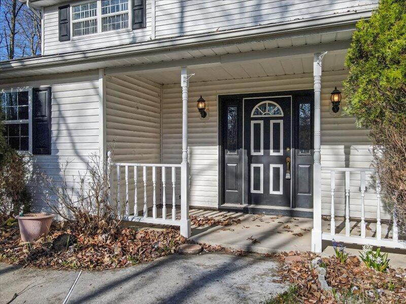 1135 Juno Drive Effort, PA 18330 - Photo 7 of 68 a front view of a house with a plants