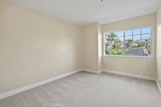 a bathroom with a granite countertop sink a mirror and a bathtub