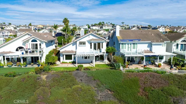 an aerial view of residential building and lake