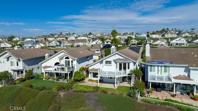 an aerial view of residential building and lake
