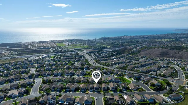 an aerial view of a houses with a city street