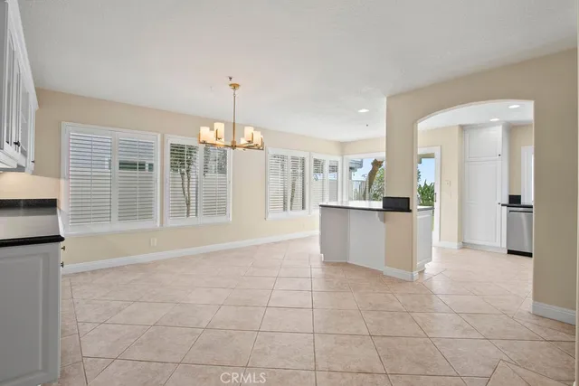 a view of a kitchen with a sink and an open kitchen view