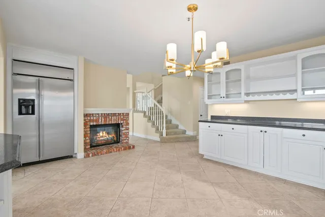 a large kitchen with stainless steel appliances granite countertop a stove and a sink