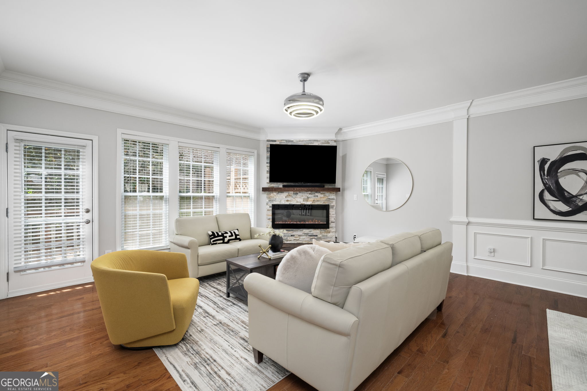2872 Overlook Way Northeast Atlanta, GA 30324 - Photo 13 of 43 a living room with furniture a flat screen tv and wooden floor