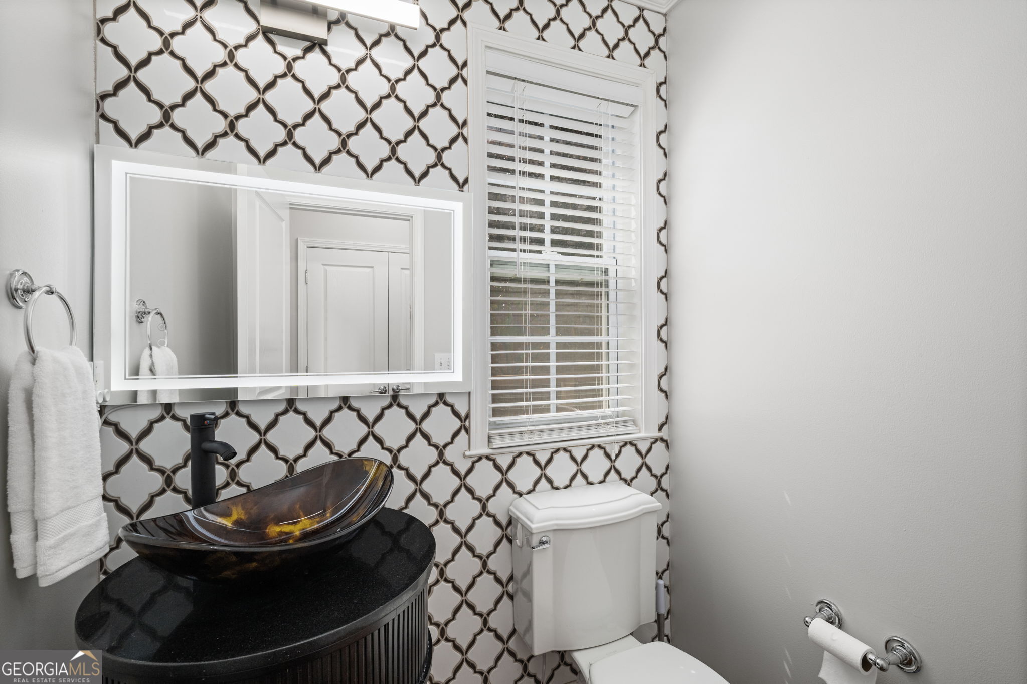 2872 Overlook Way Northeast Atlanta, GA 30324 - Photo 15 of 43 a bathroom with a sink and a toilet