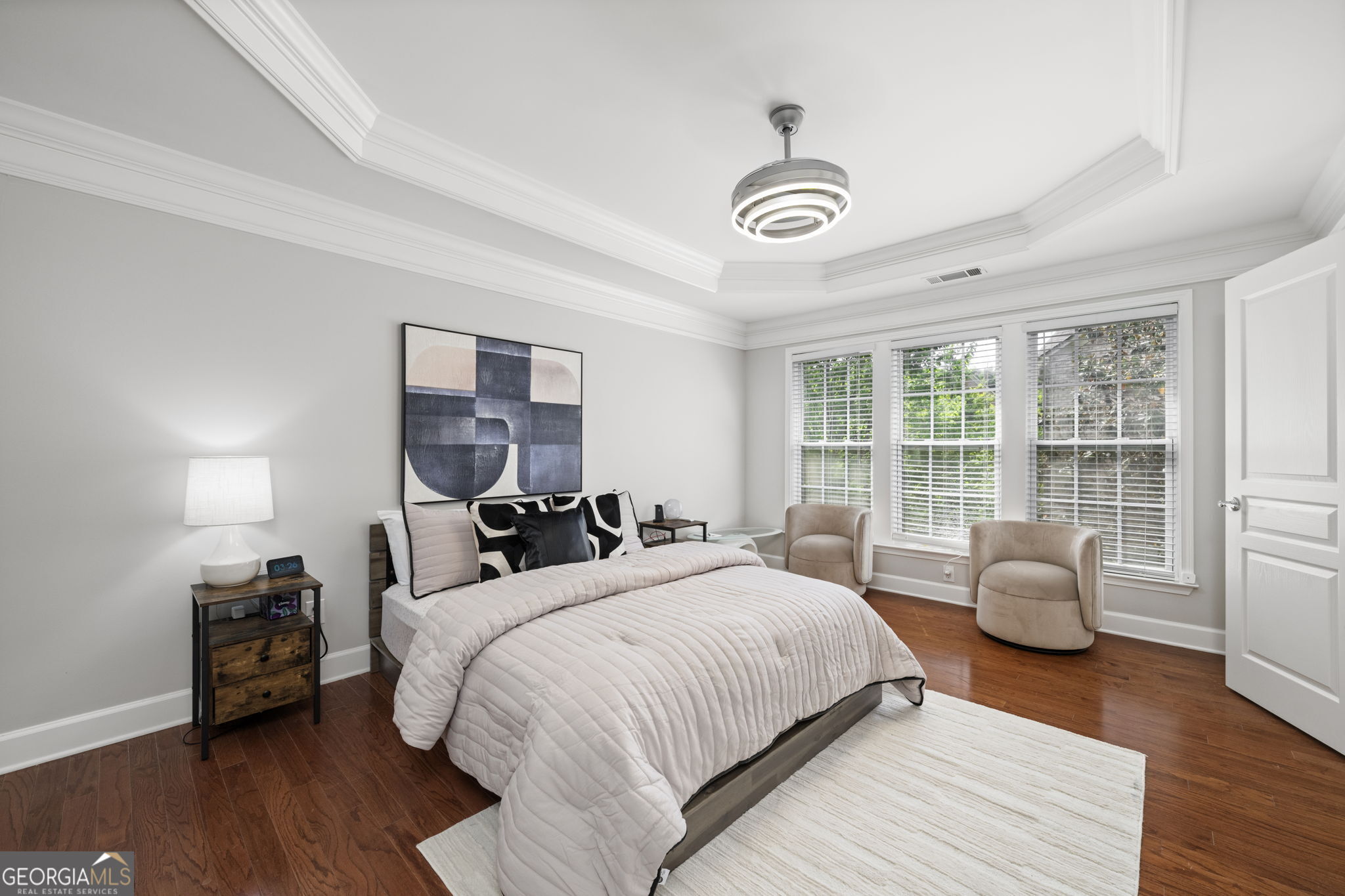 2872 Overlook Way Northeast Atlanta, GA 30324 - Photo 17 of 43 a bedroom with a bed and wooden floor