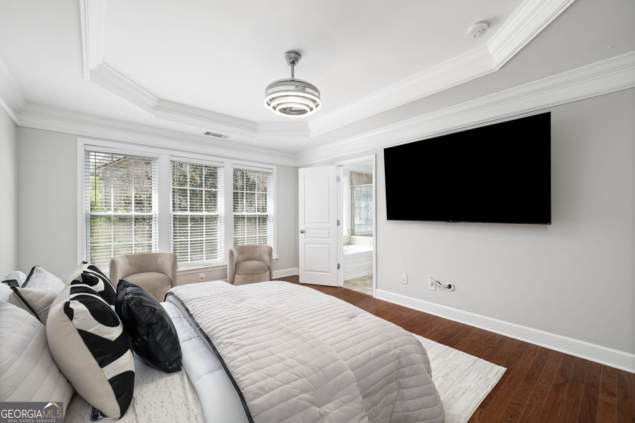 2872 Overlook Way Northeast Atlanta, GA 30324 - Photo 18 of 43 a bedroom with a bed a television and a large window