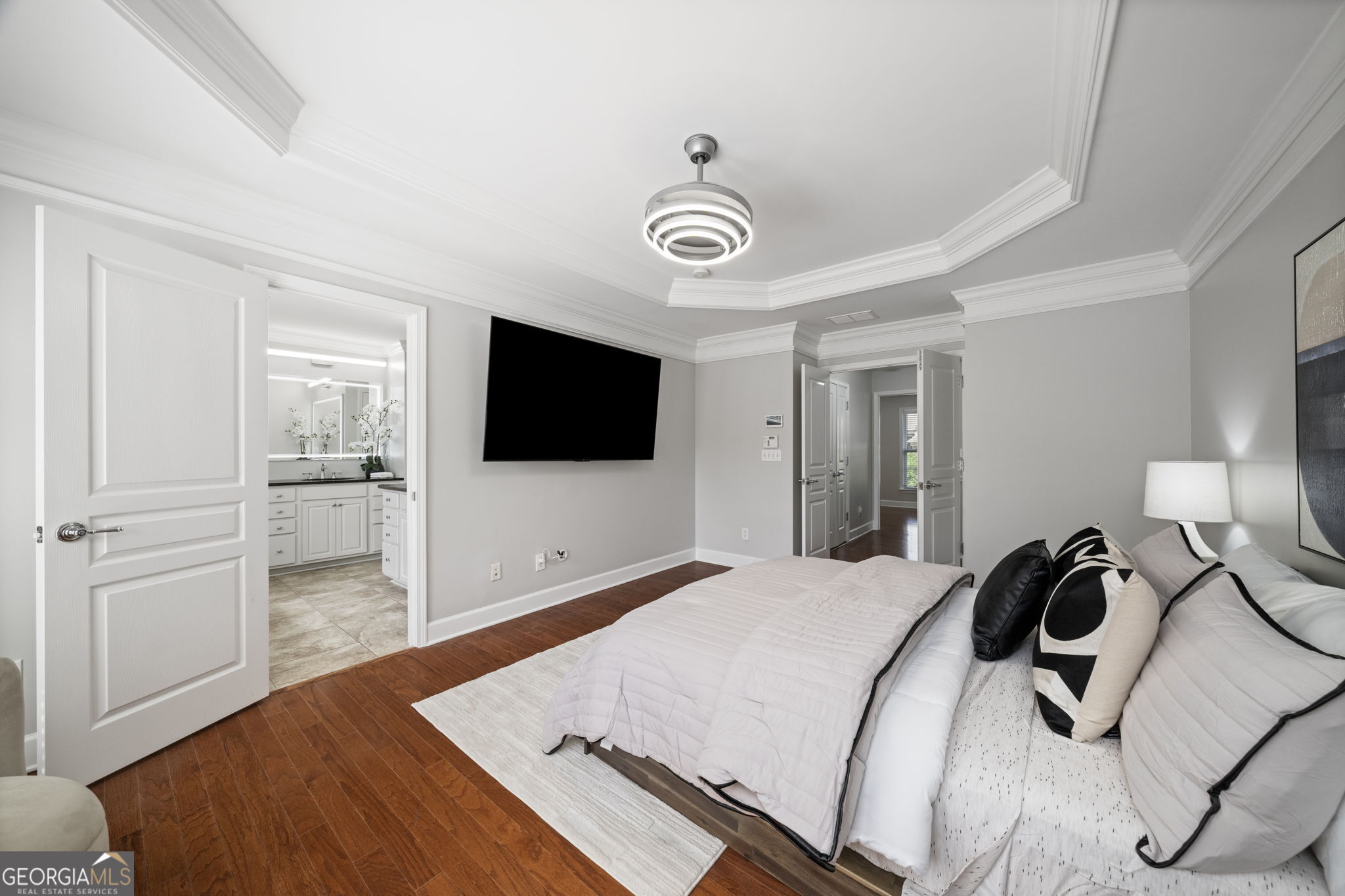 2872 Overlook Way Northeast Atlanta, GA 30324 - Photo 20 of 43 a bedroom with a bed and a flat screen tv