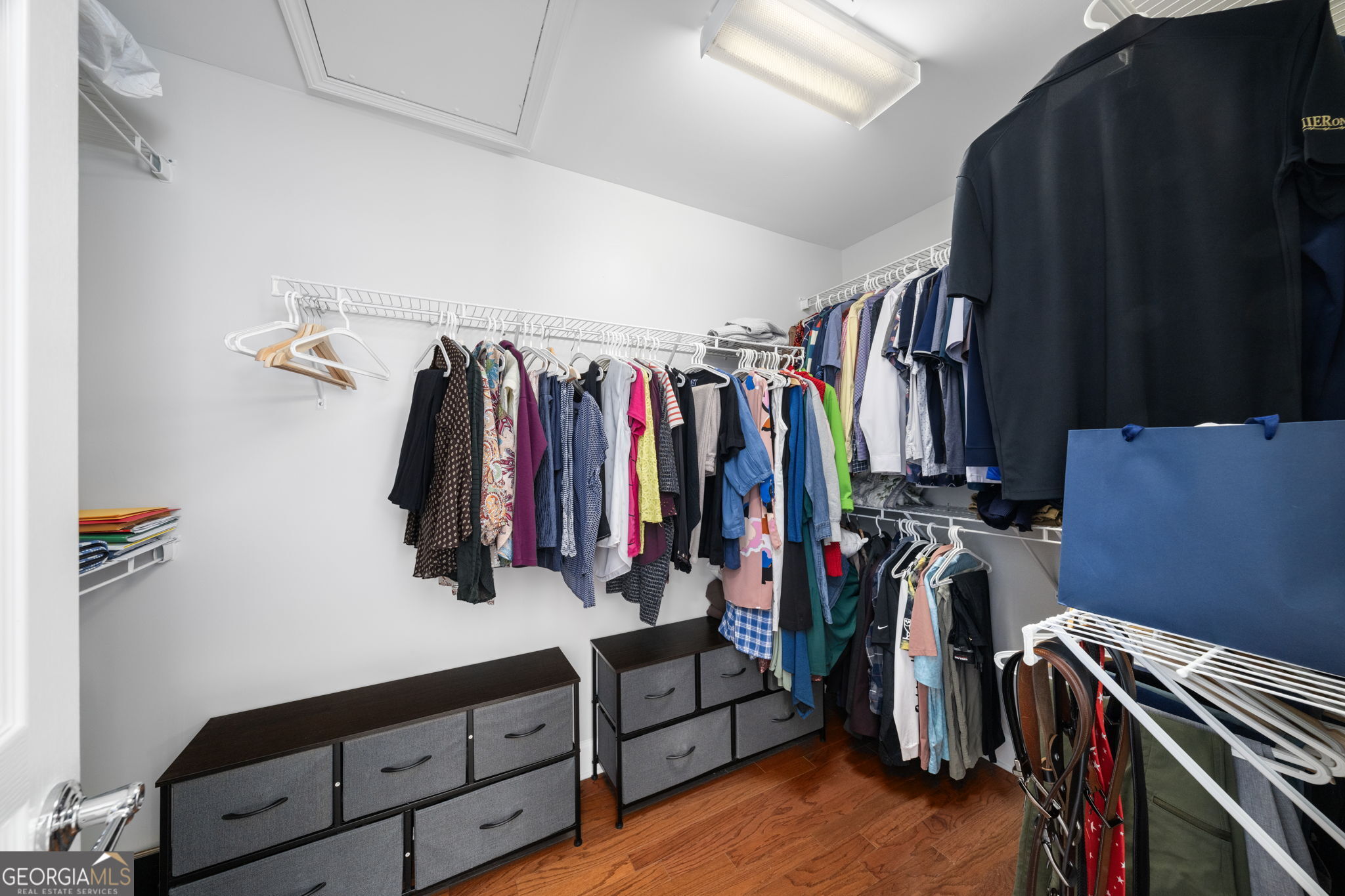 2872 Overlook Way Northeast Atlanta, GA 30324 - Photo 24 of 43 a view of walk in closet with clothes