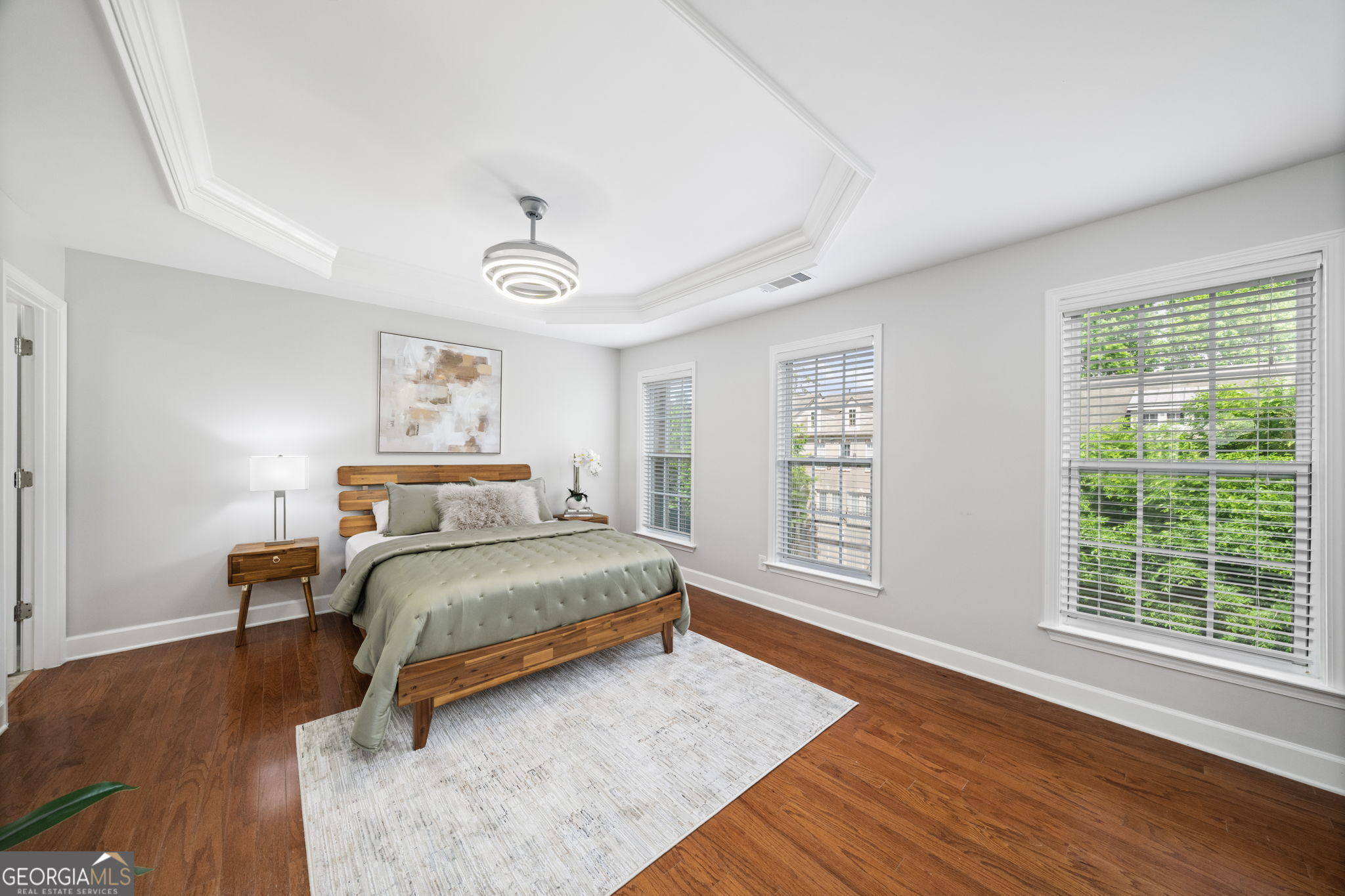 2872 Overlook Way Northeast Atlanta, GA 30324 - Photo 26 of 43 a bedroom with a bed and wooden floor