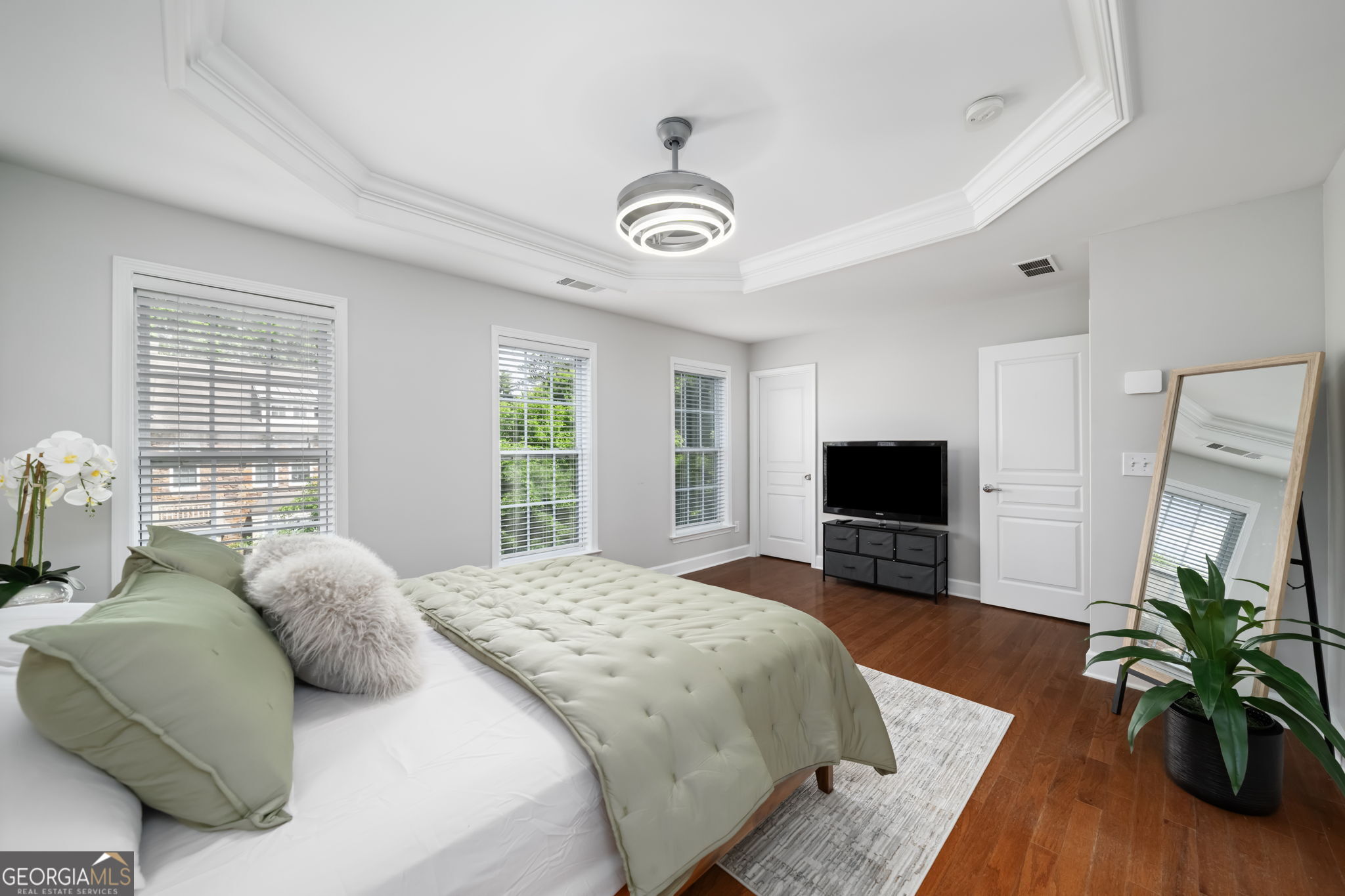 2872 Overlook Way Northeast Atlanta, GA 30324 - Photo 29 of 43 a bedroom with a bed and a flat screen tv