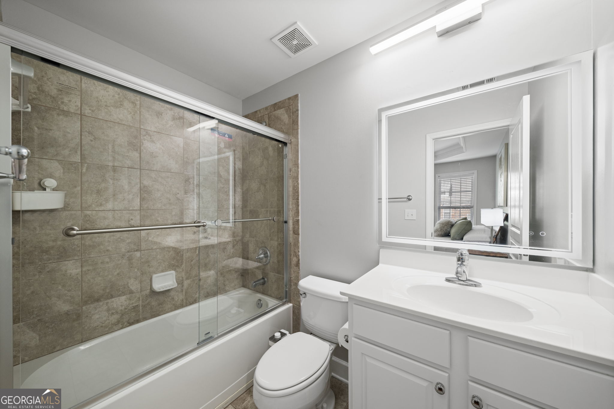 2872 Overlook Way Northeast Atlanta, GA 30324 - Photo 30 of 43 a bathroom with a sink a toilet and a mirror