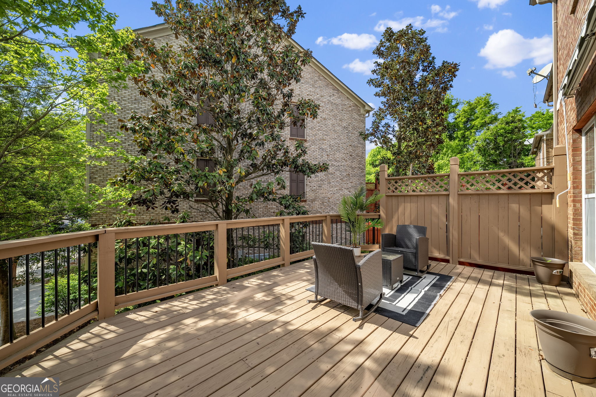 2872 Overlook Way Northeast Atlanta, GA 30324 - Photo 37 of 43 a view of a balcony with wooden floor and outdoor seating