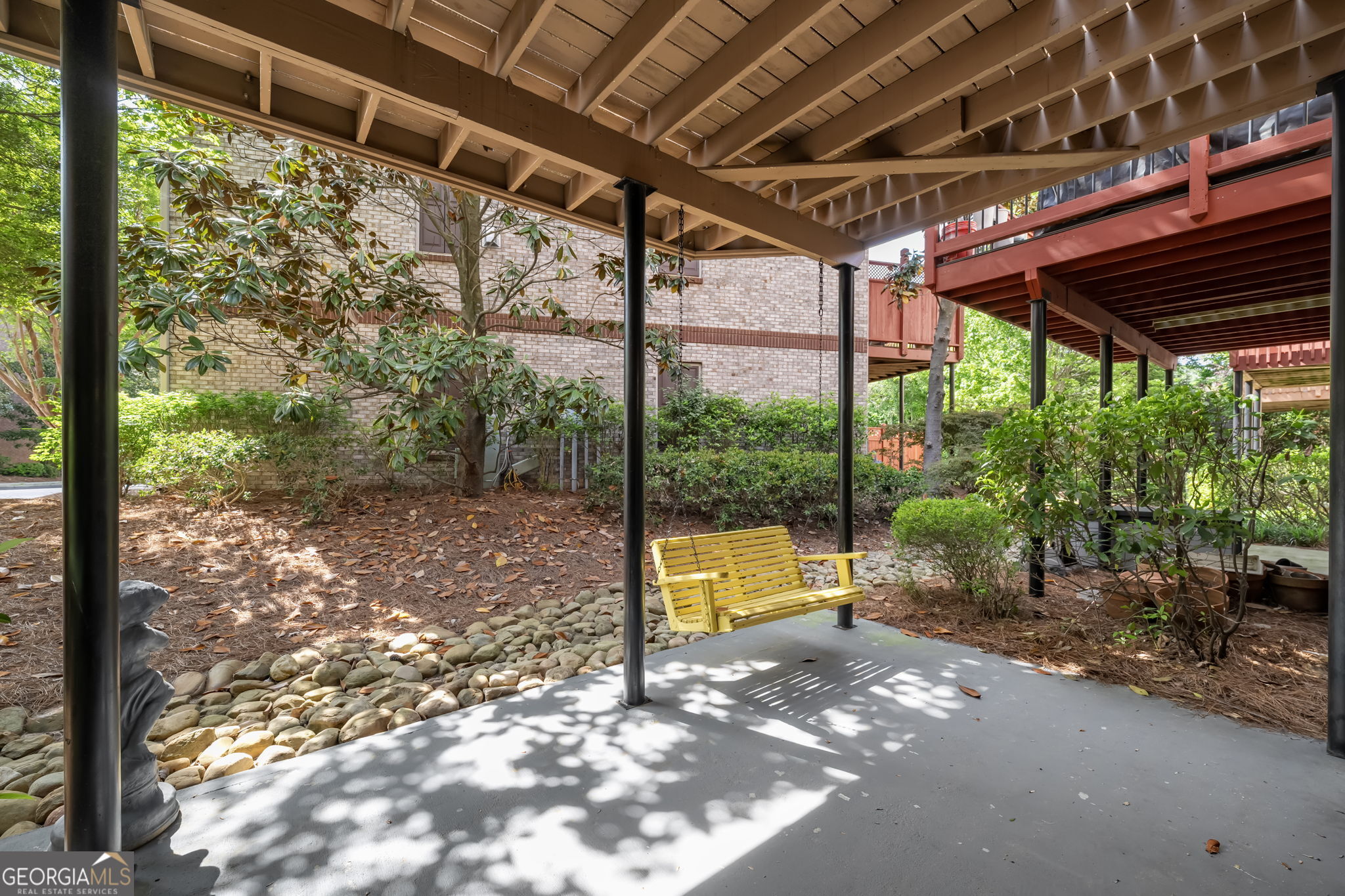 2872 Overlook Way Northeast Atlanta, GA 30324 - Photo 39 of 43 a view of a backyard with table and chairs under an umbrella with a small yard