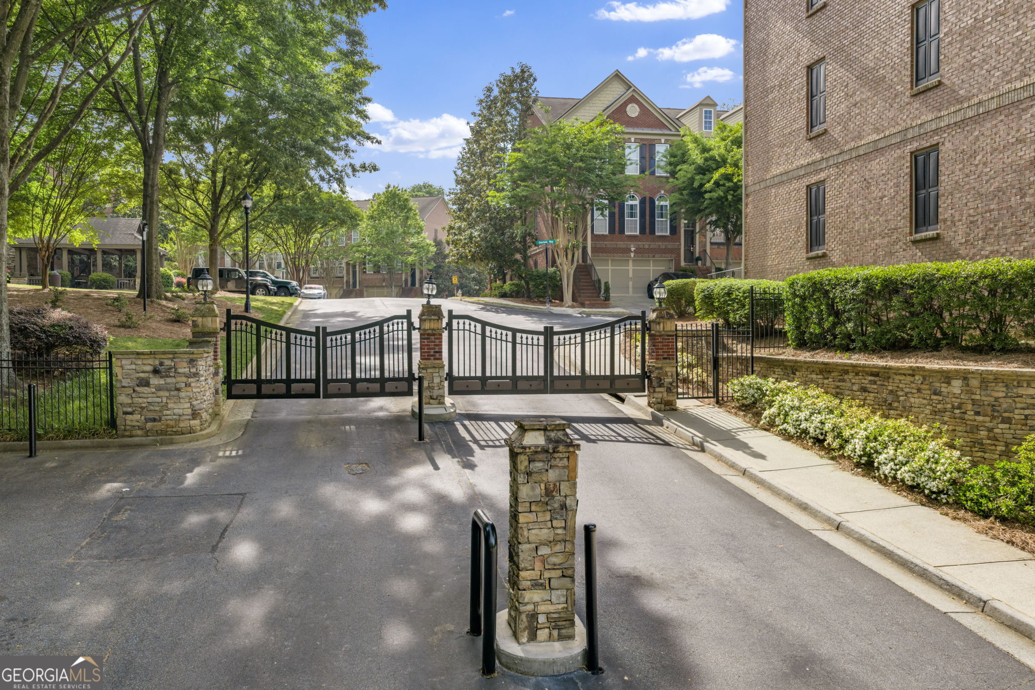 2872 Overlook Way Northeast Atlanta, GA 30324 - Photo 43 of 43 a view of a street with brick wall park