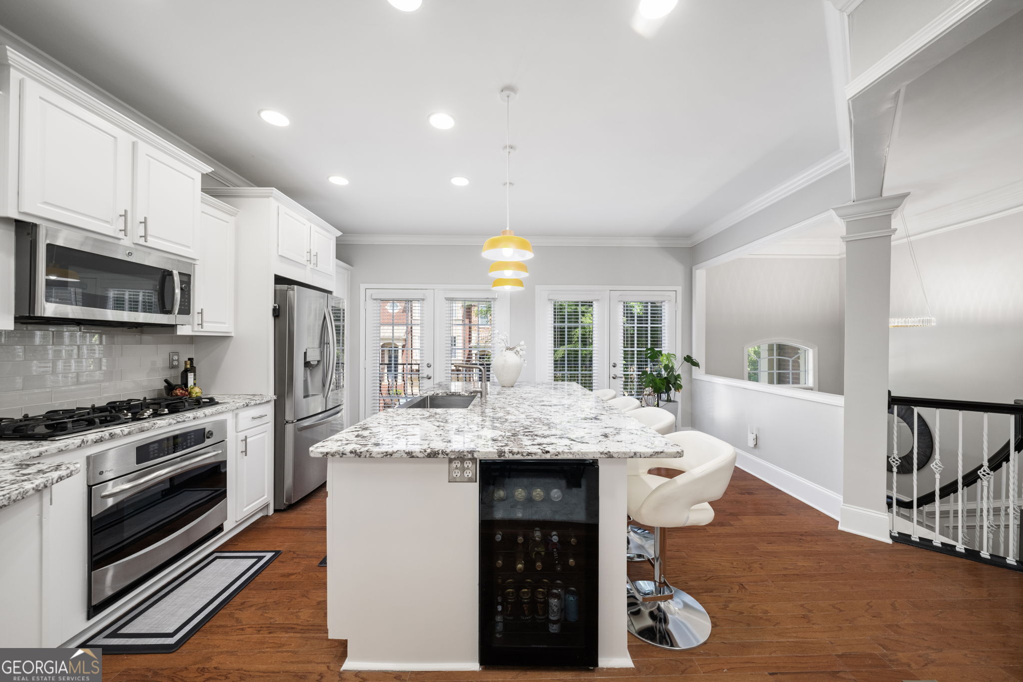 2872 Overlook Way Northeast Atlanta, GA 30324 - Photo 10 of 43 a kitchen with stainless steel appliances kitchen island granite countertop a stove a sink and a refrigerator