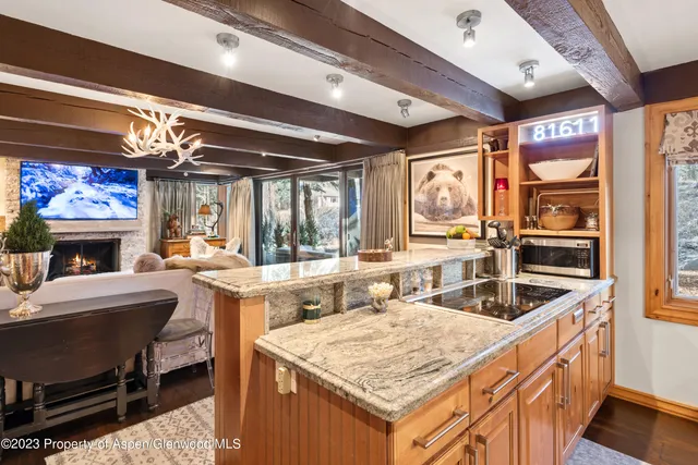 a kitchen with a stove and a refrigerator