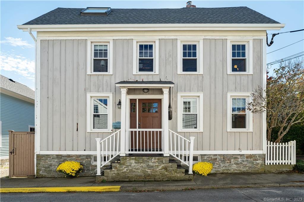 19 Diving Street Stonington, CT 06378 - Photo 1 of 1 a view of front door of house with staircase