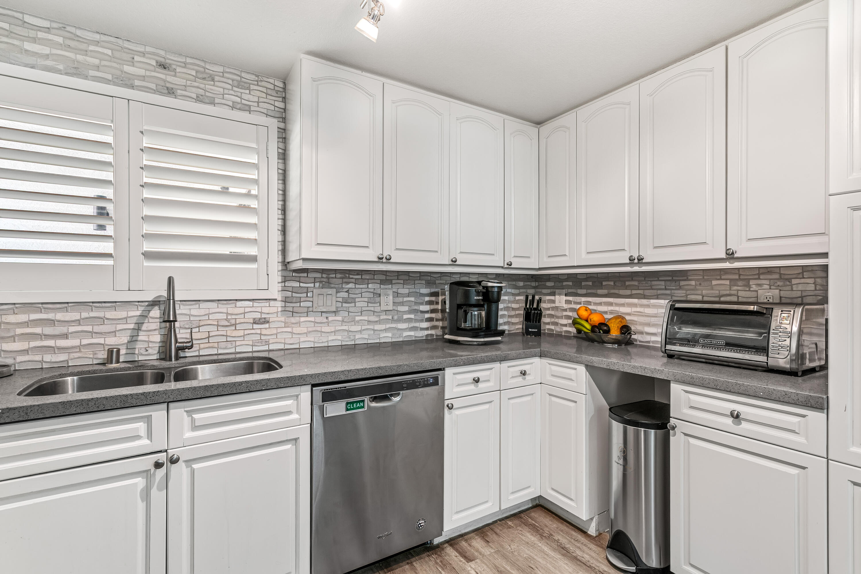 67265 Rango Road Cathedral City, CA 92234 - Photo 20 of 49 a kitchen with stainless steel appliances granite countertop a sink a stove and a microwave