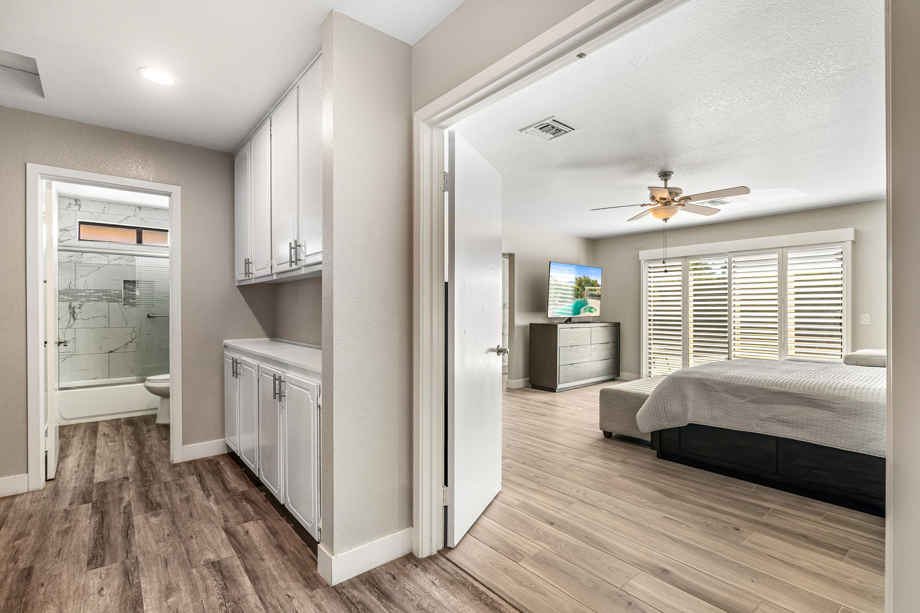 67265 Rango Road Cathedral City, CA 92234 - Photo 24 of 49 a spacious bedroom with a bed and a large window