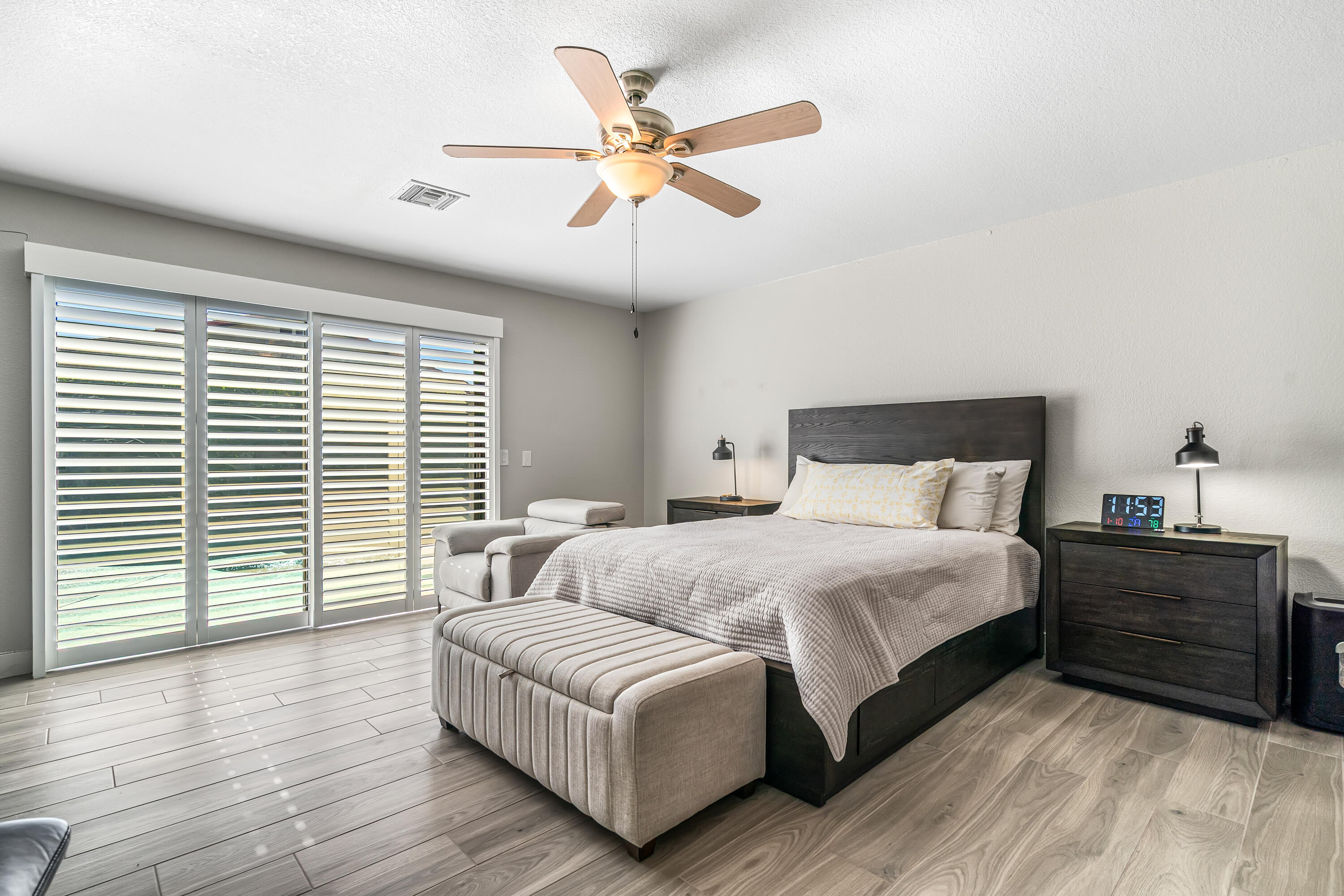 67265 Rango Road Cathedral City, CA 92234 - Photo 27 of 49 a bedroom with a large bed and a large window