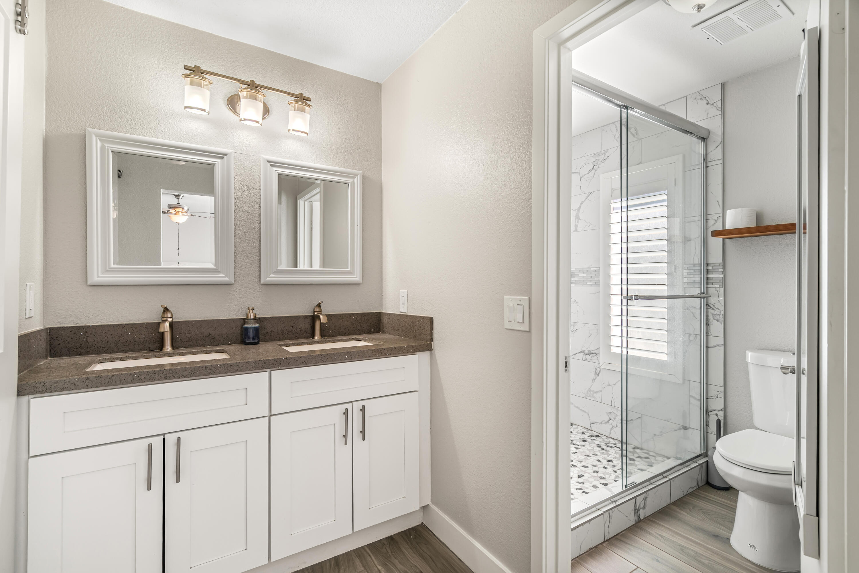 67265 Rango Road Cathedral City, CA 92234 - Photo 30 of 49 a bathroom with a granite countertop sink toilet and shower