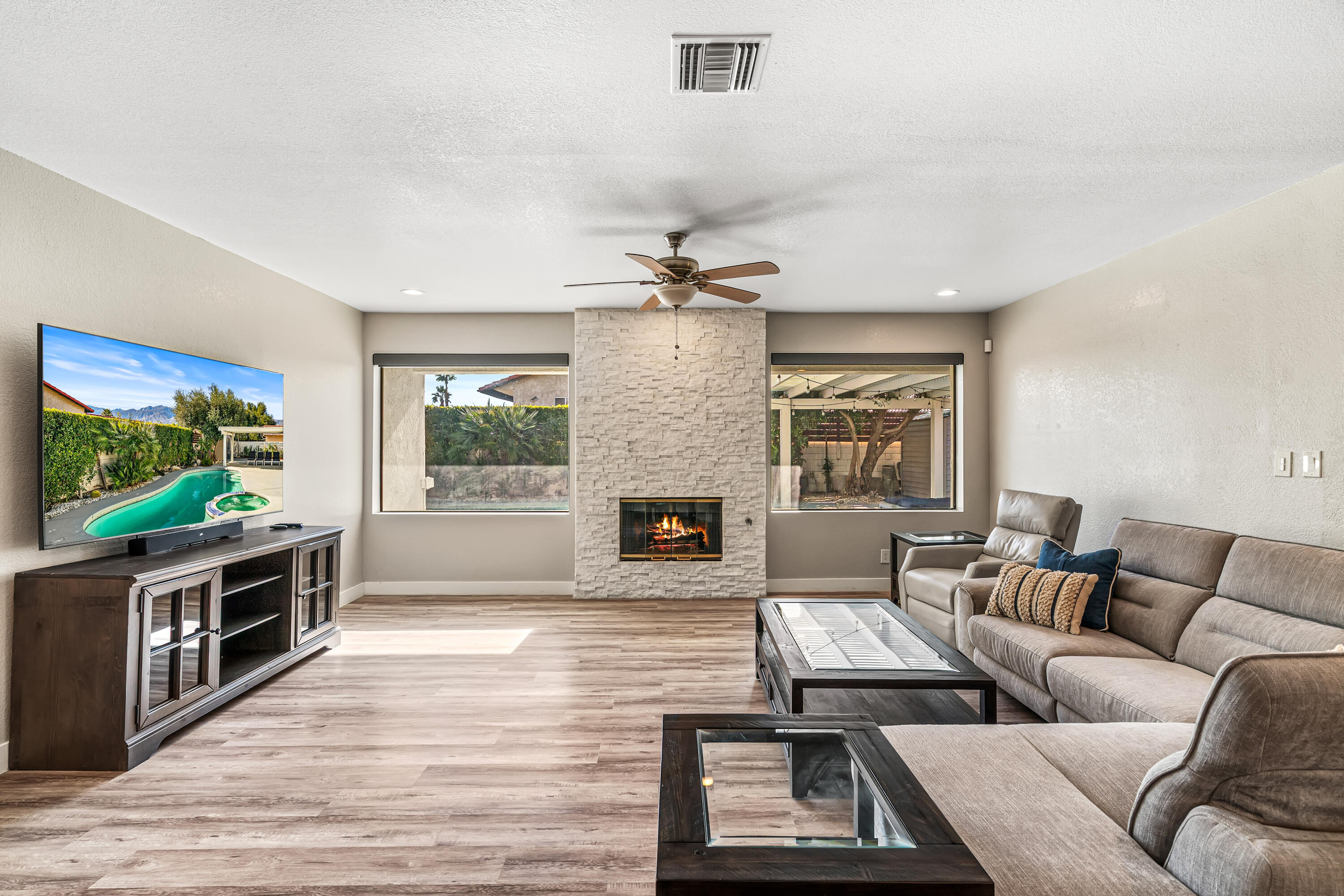 67265 Rango Road Cathedral City, CA 92234 - Photo 3 of 49 a living room with furniture and a flat screen tv