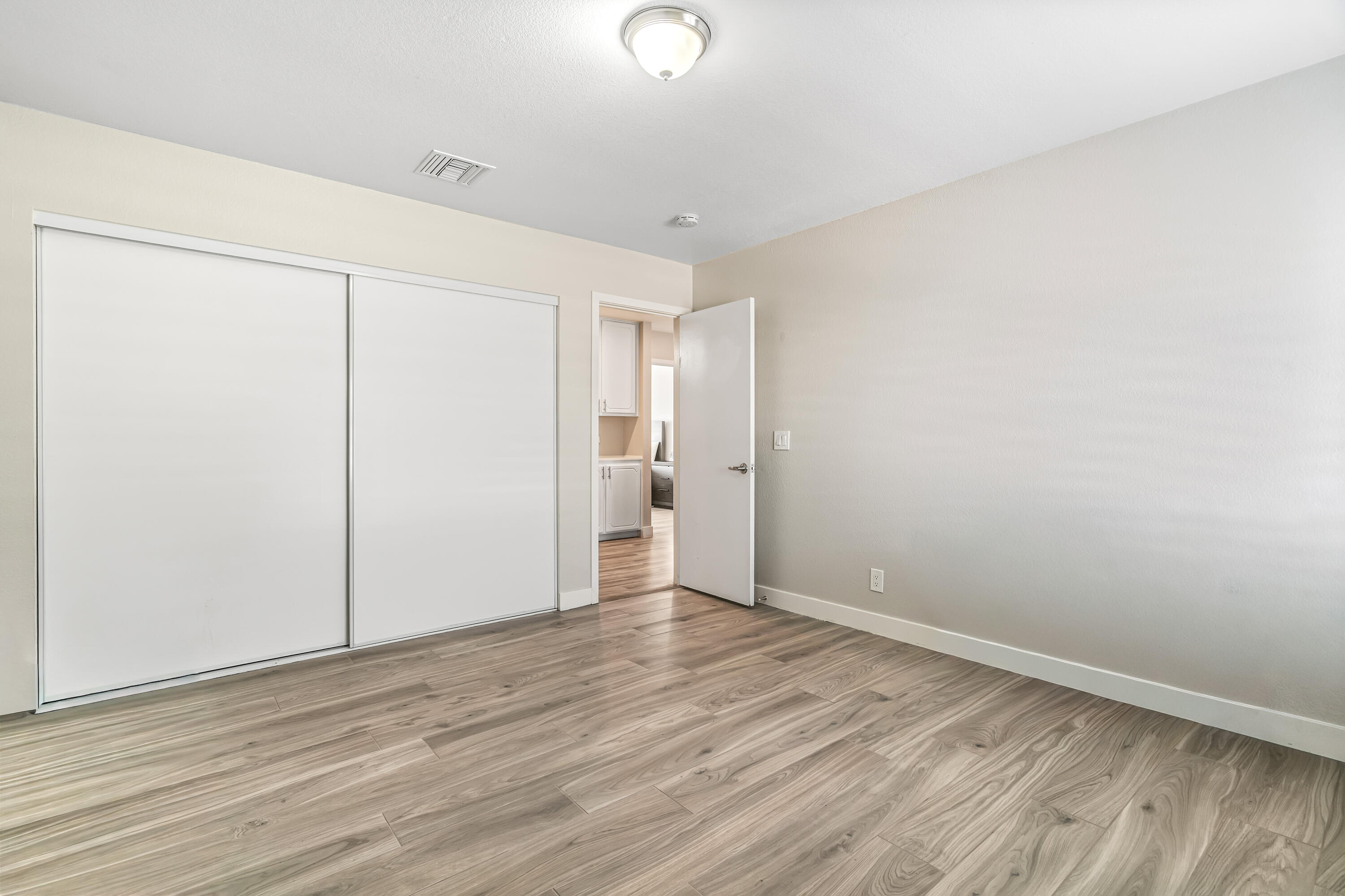 67265 Rango Road Cathedral City, CA 92234 - Photo 33 of 49 a view of an empty room with wooden floor